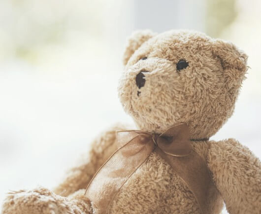 ECV procedure demonstration with teddy bear and hands positioning